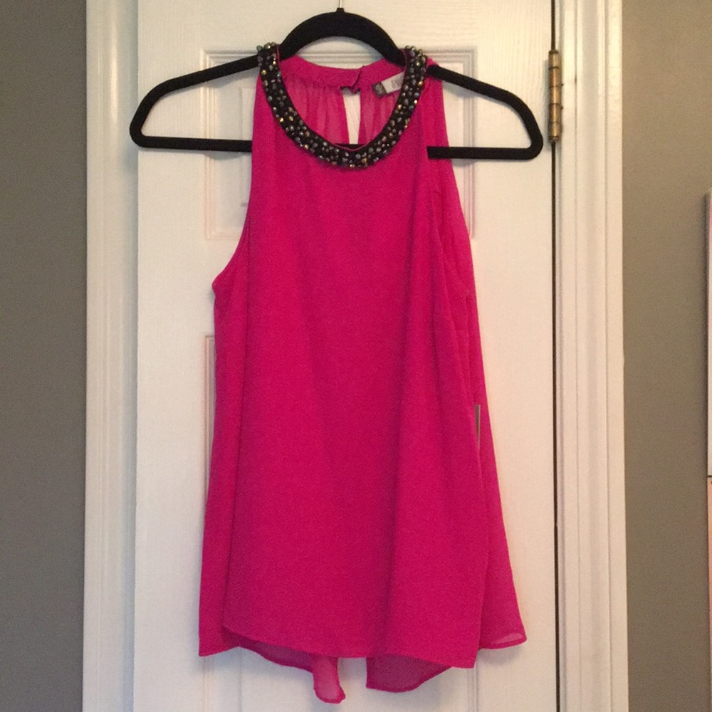 Jennifer Lopez pink blouse with neck embellishment